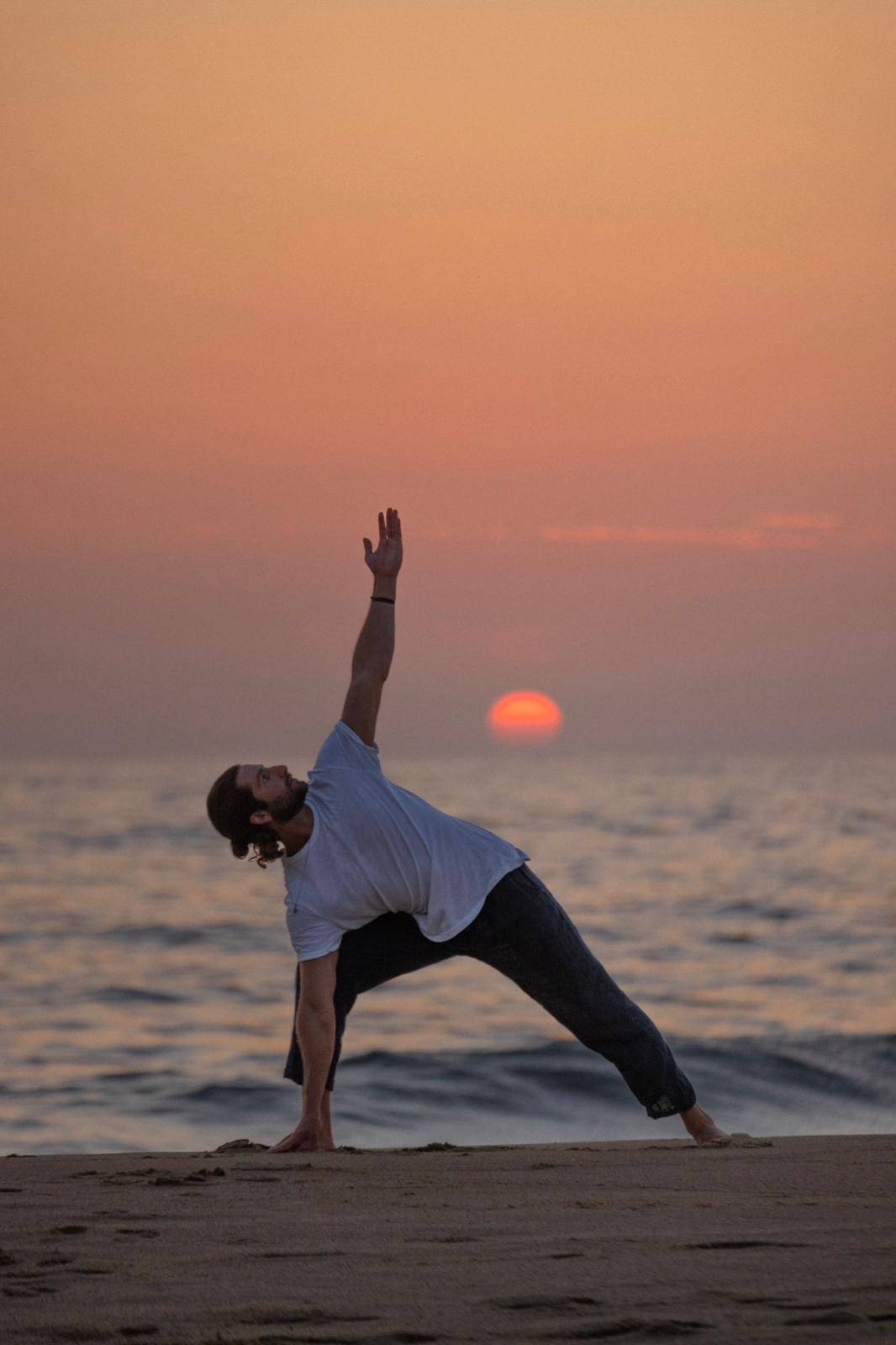 Doug doing yoga at sunset